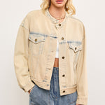 Light wash casual denim jacket in sand denim with cropped boxy fit (bomber fit jacket) on a model