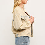 Side view of light wash casual denim jacket showing cropped boxy silhouette