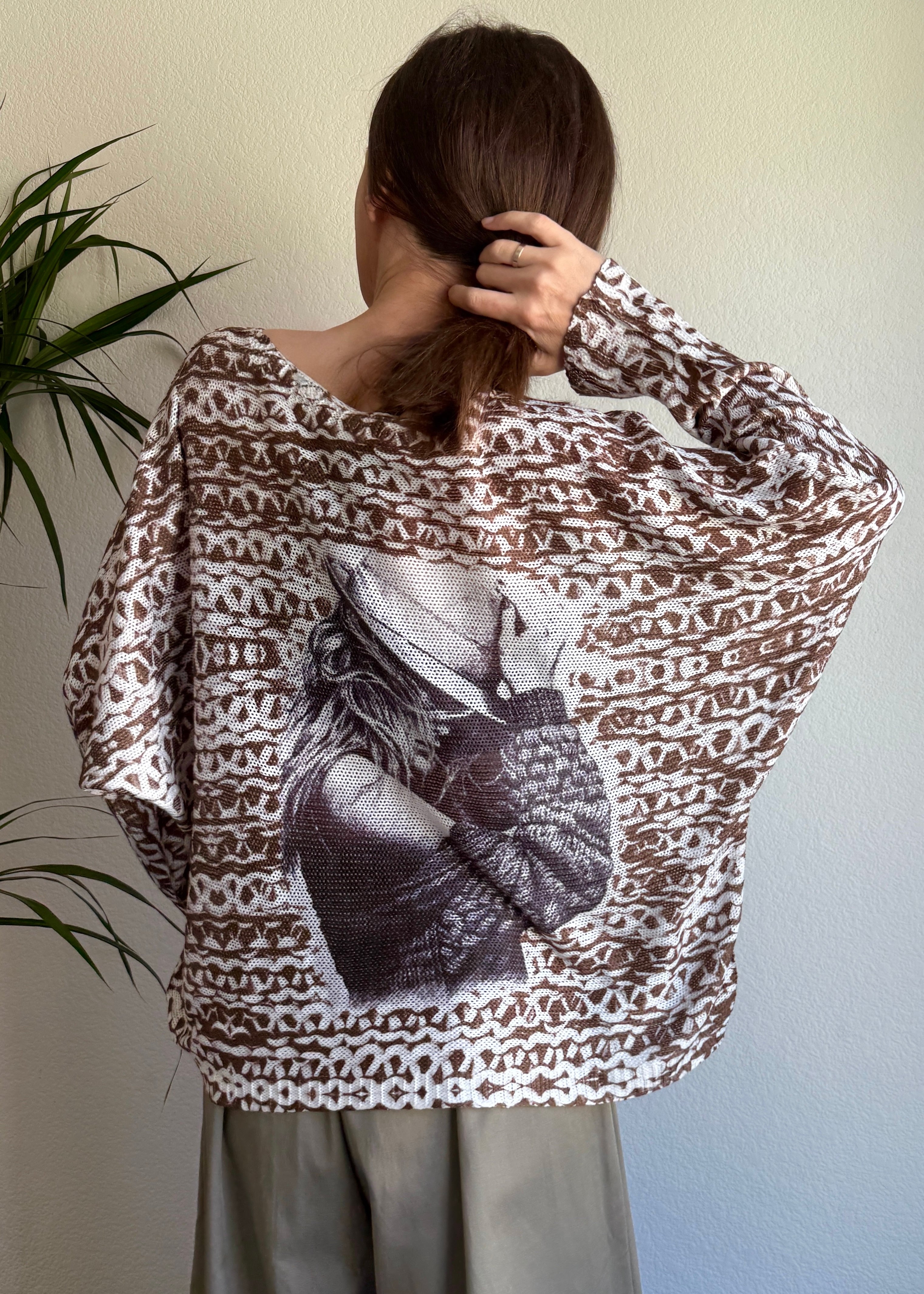Back view of the batwing sweater showing relaxed oversized silhouette