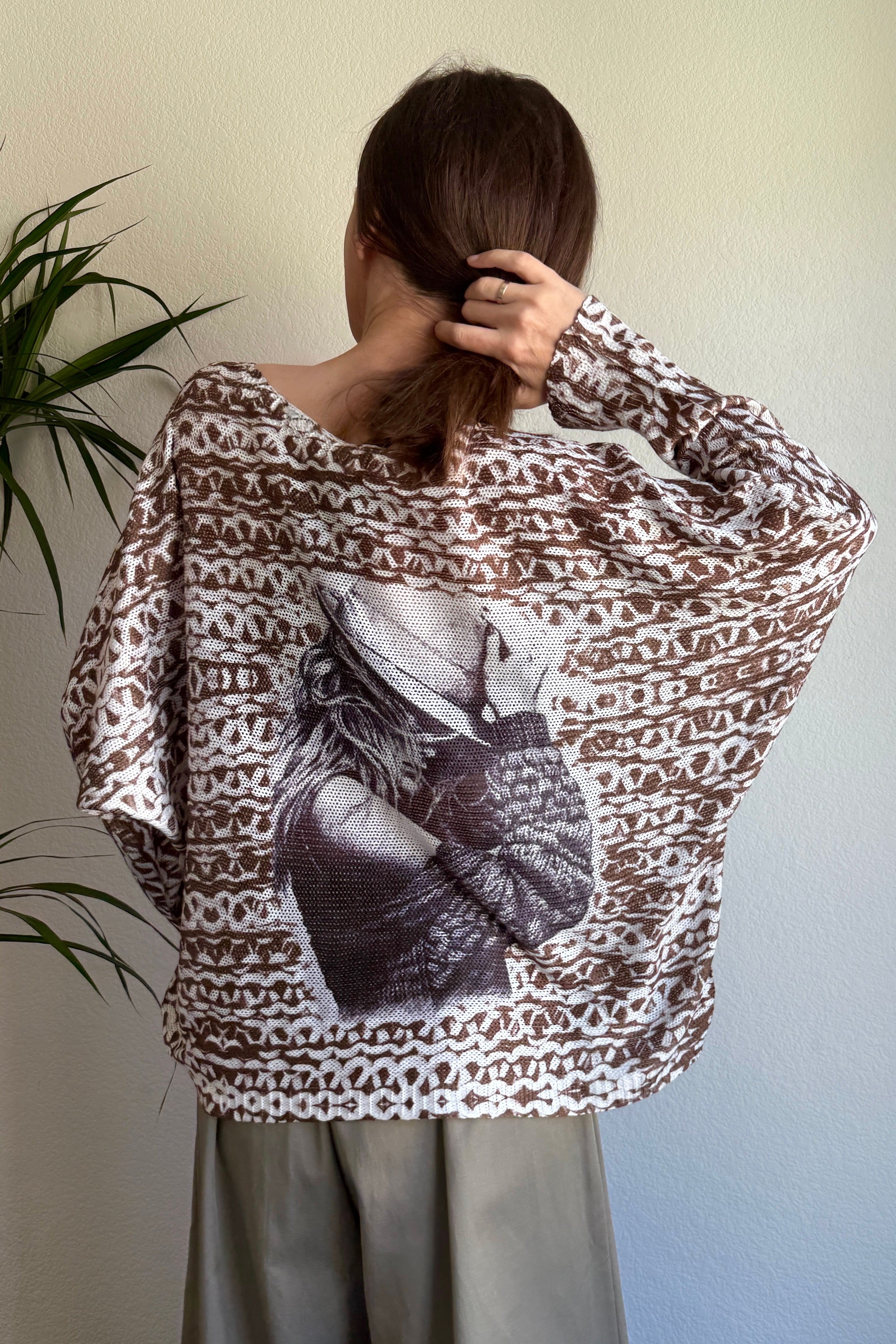 Back view of the batwing sweater showing relaxed oversized silhouette