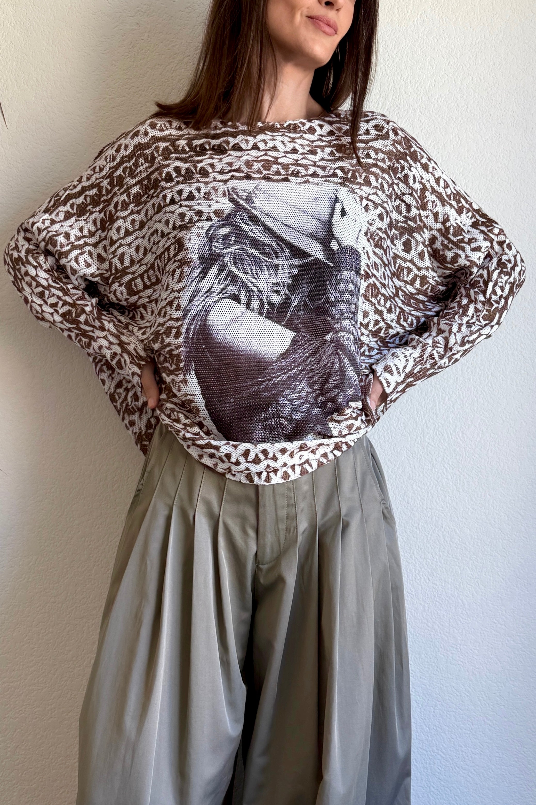Styled front view of the Livia batwing printed sweater in a casual indoor setting