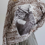 Close-up front detail highlighting the cowgirl print and soft knit texture
