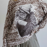 Close-up front detail highlighting the cowgirl print and soft knit texture