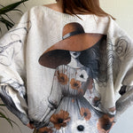 Back view of the sweater highlighting the oversized batwing fit