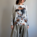 Front portrait of model wearing the Livia Made in Italy batwing printed sweater with Lady in Hat artwork