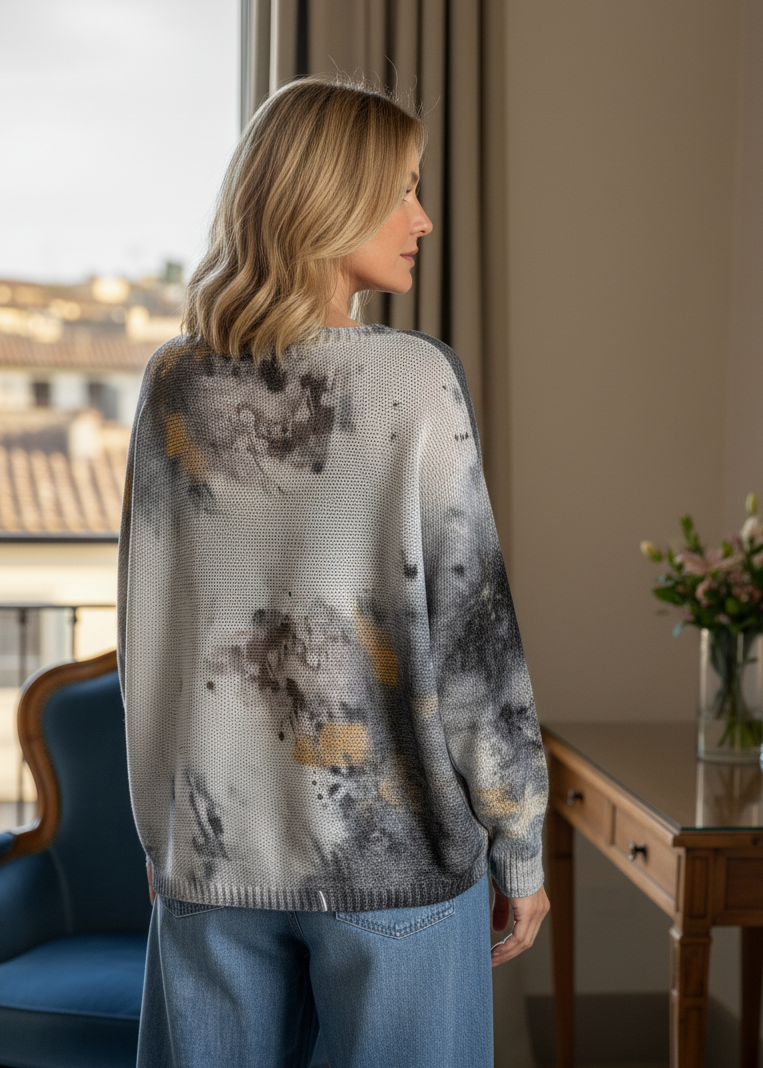 Back view of the batwing printed sweater showing relaxed fit and abstract pattern