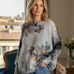 Front portrait of model wearing the Livia Made in Italy batwing printed sweater in smoke and gold abstract print
