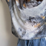 Side view of the batwing sweater showing drape, sleeve shape, and relaxed silhouette