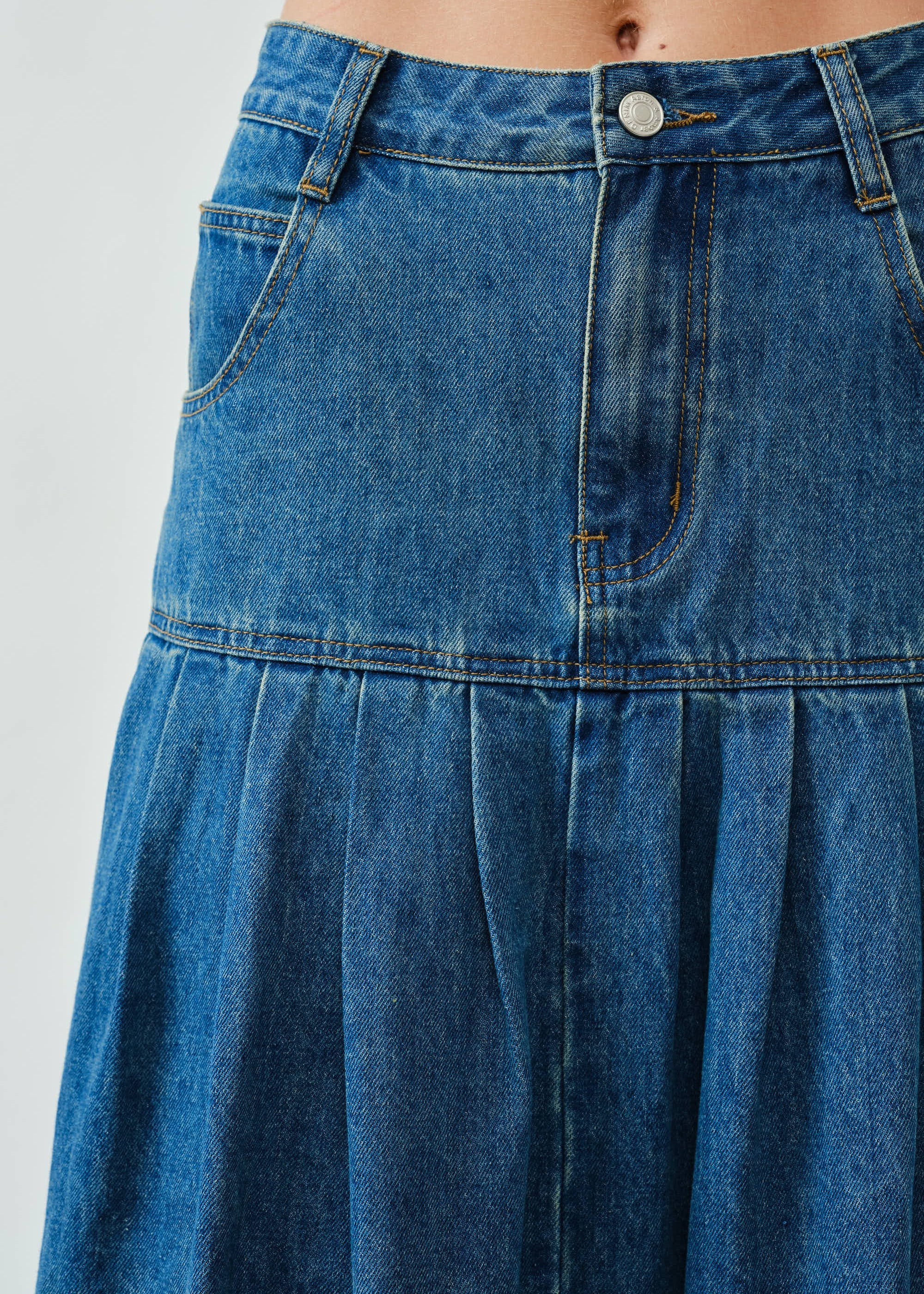 Close-up of the front basque waist and denim texture