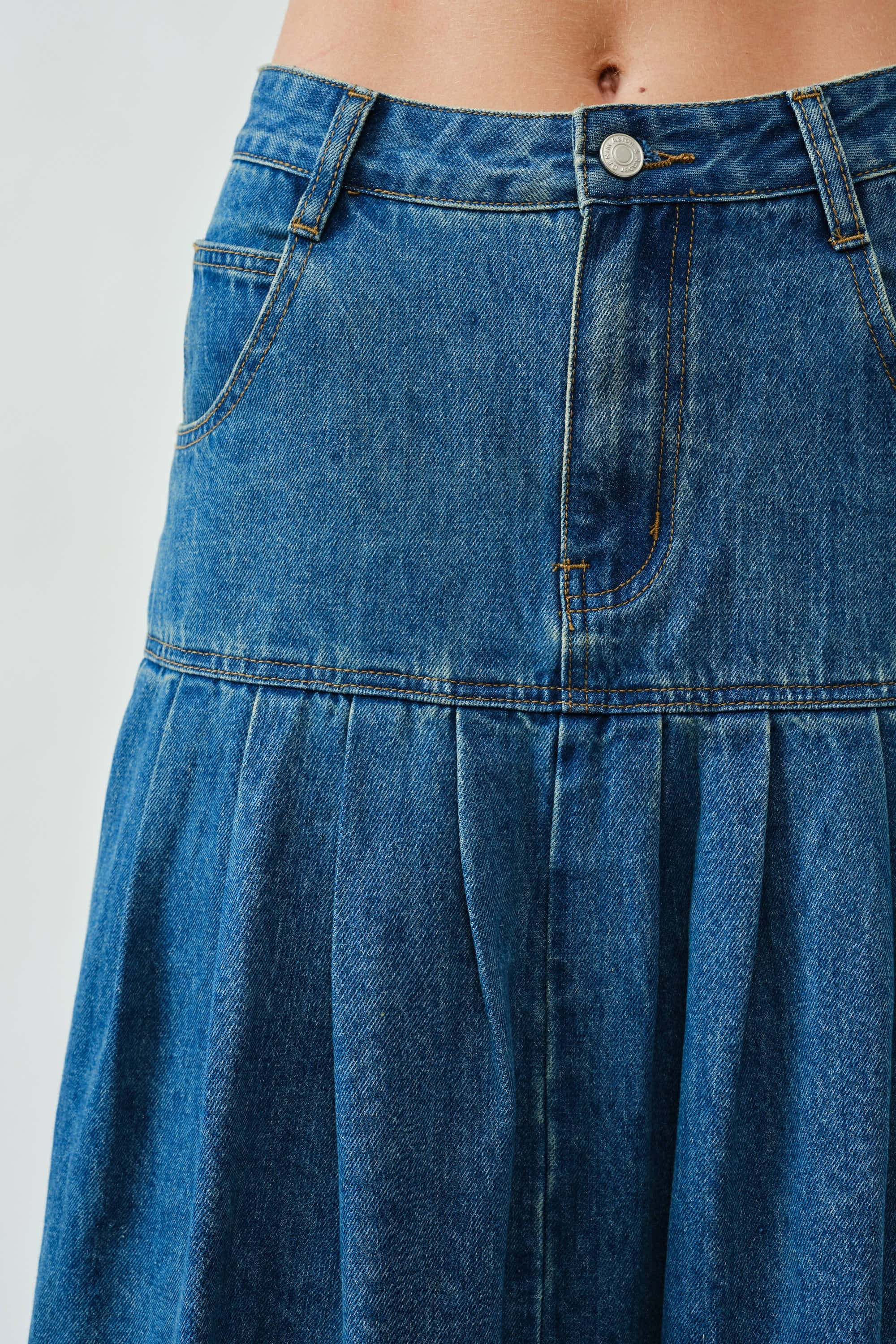 Close-up of the front basque waist and denim texture