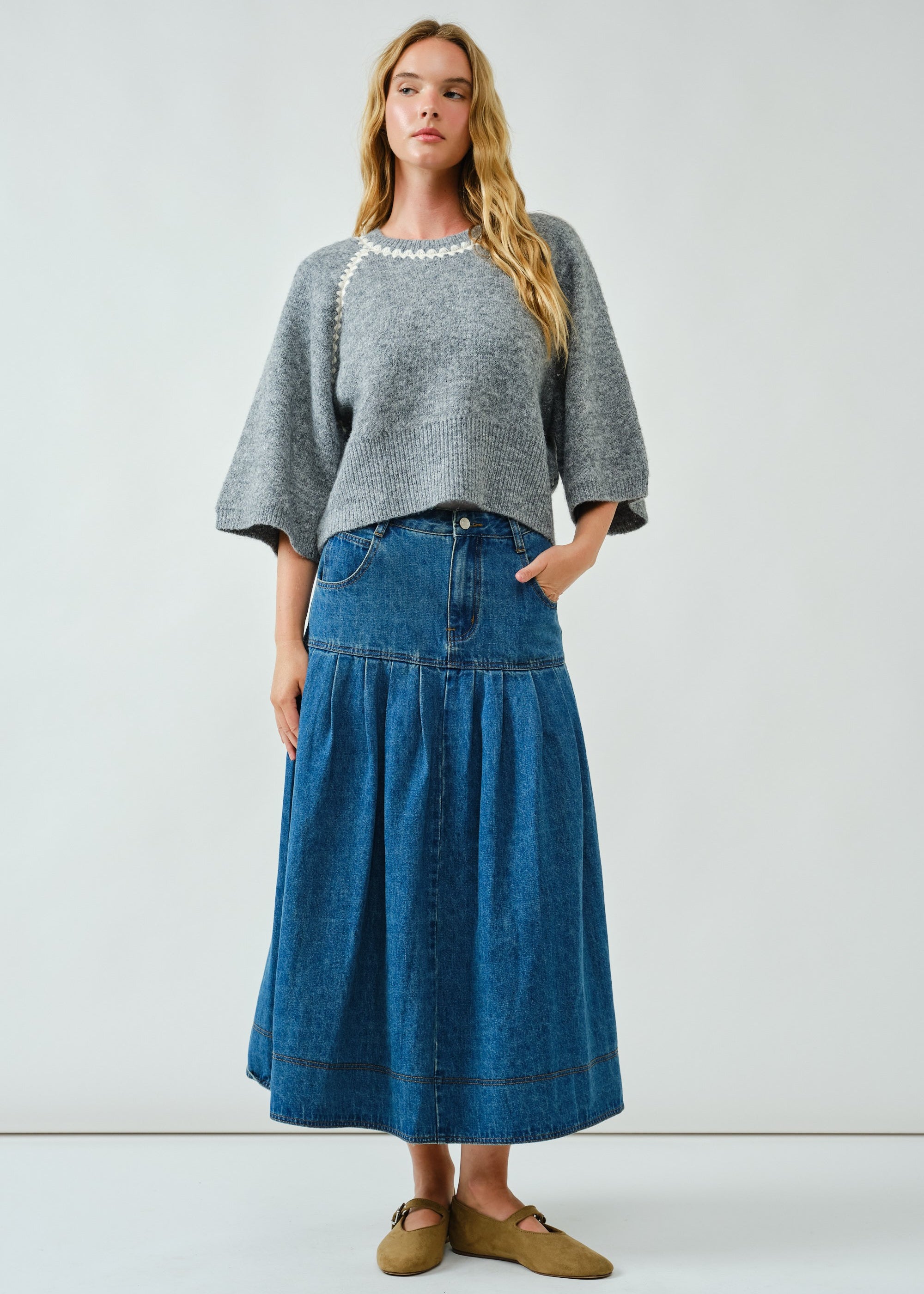 Full-body front view of the Lotus Basque Denim Midi Skirt styled with flats