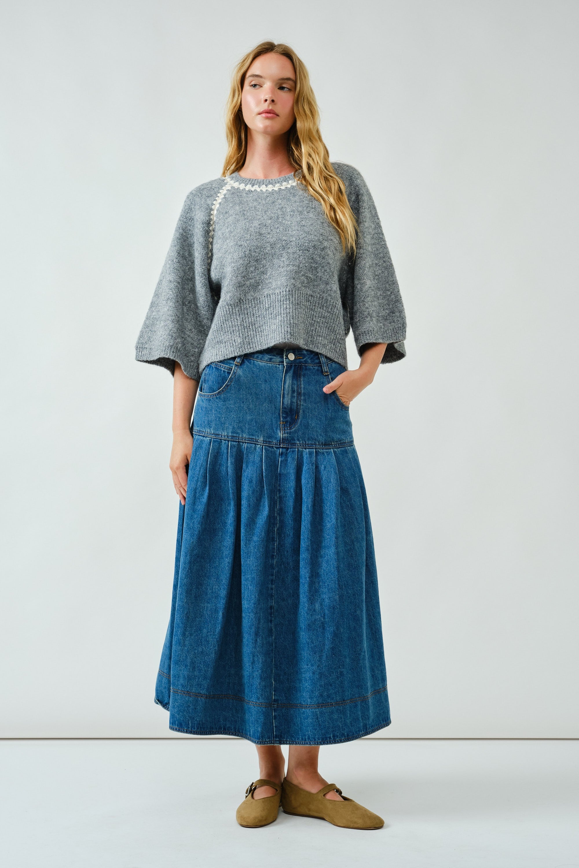Full-body front view of the Lotus Basque Denim Midi Skirt styled with flats