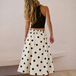 Lowen Full Midi Skirt in Polka Dot Cream,back view of full A-line midi skirt with black polka dots and gathered waist