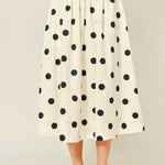 Lowen Full Midi Skirt in Polka Dot Cream, front view of full A-line midi skirt with black polka dots and gathered waist