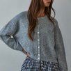 Woman wearing  Lucas Button-Down Knit Cardigan in heather grey with round neckline and buttons