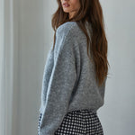 Back-side view of Lucas Button-Down Knit Cardigan in heather grey showing relaxed knit fit