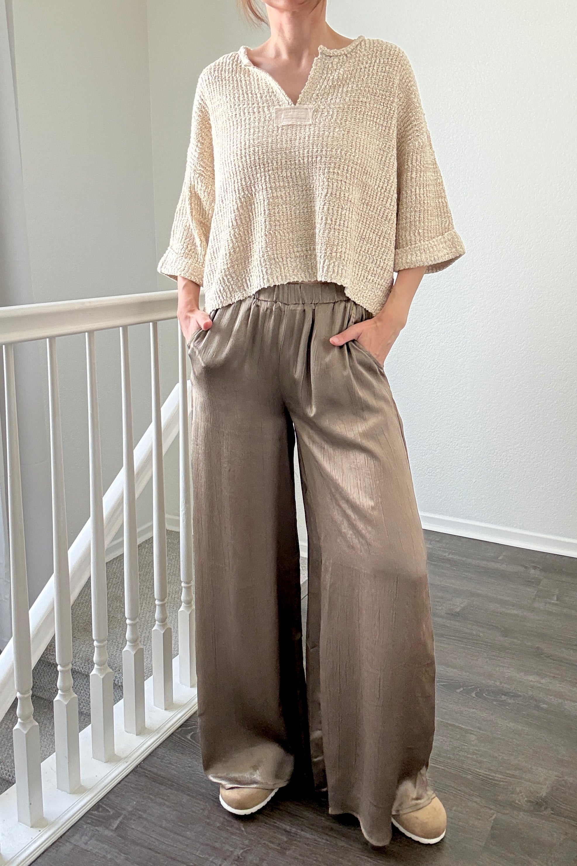 Person wearing Luna Satin Wide Leg Pants in Olive 