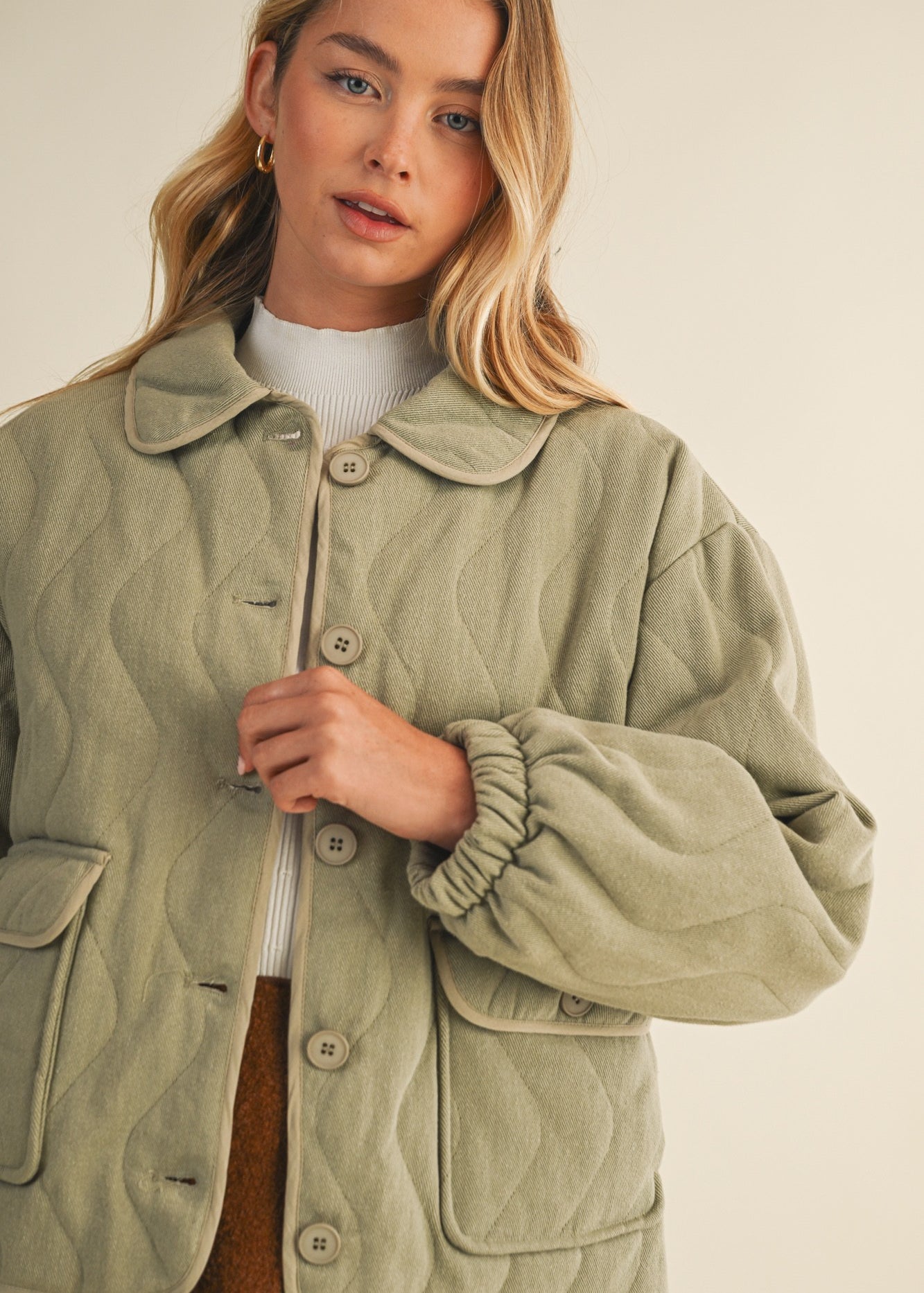 Close-up front detail of the wave quilting and cotton texture