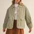 Front portrait of model wearing the Magnolia Wave Quilted Cotton Jacket in olive