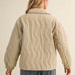 Back view of the wheat quilted cotton jacket showing wave quilting detail