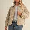 Front portrait of model wearing the Magnolia Wave Quilted Cotton Jacket in wheat