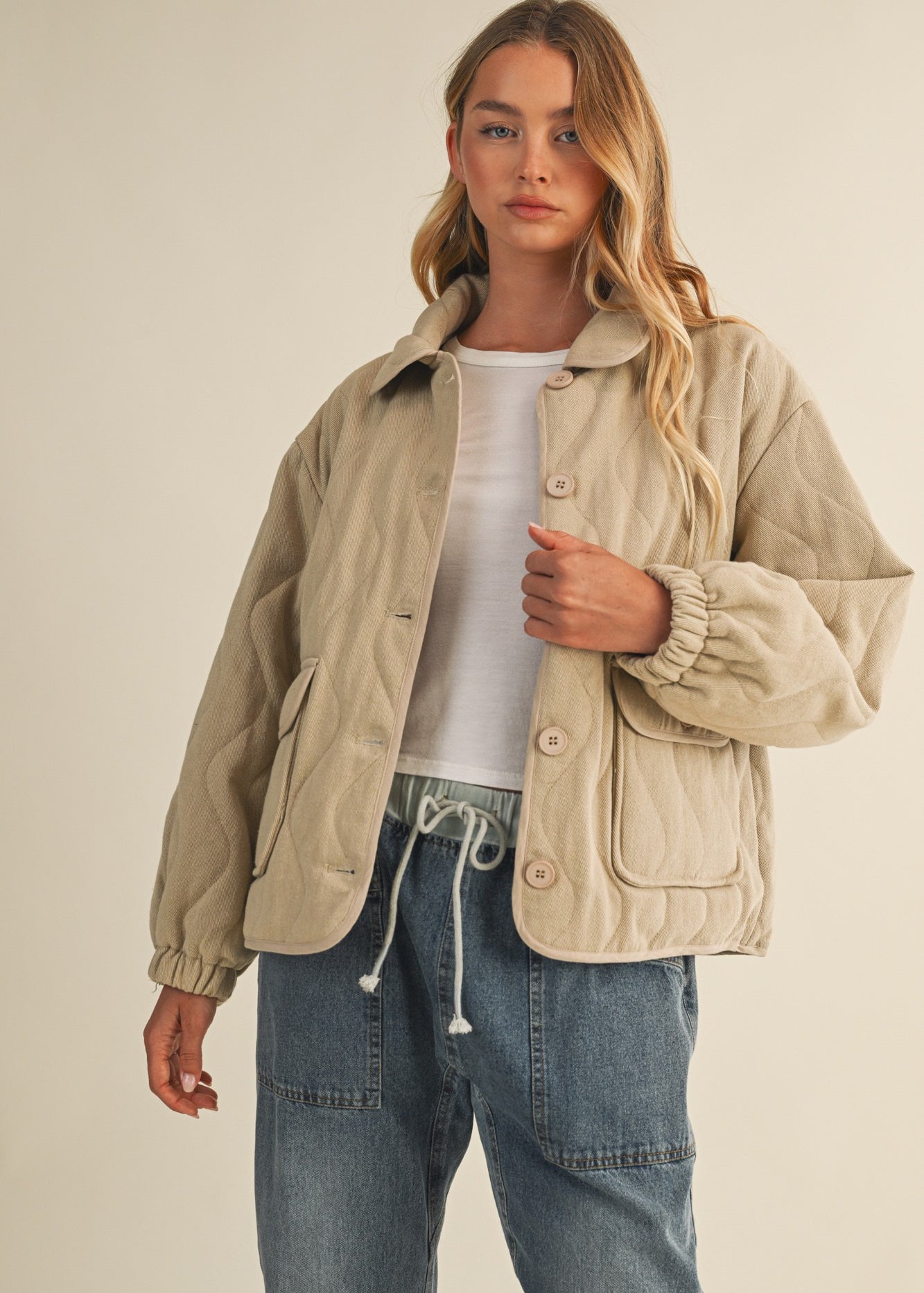 Front portrait of model wearing the Magnolia Wave Quilted Cotton Jacket in wheat