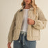 Front portrait of model wearing the Magnolia Wave Quilted Cotton Jacket in wheat