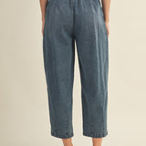 Back view of Margo pleated pull-on denim pants in washed denim