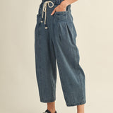 Side view of Margo pleated pull-on denim pants showing relaxed fit