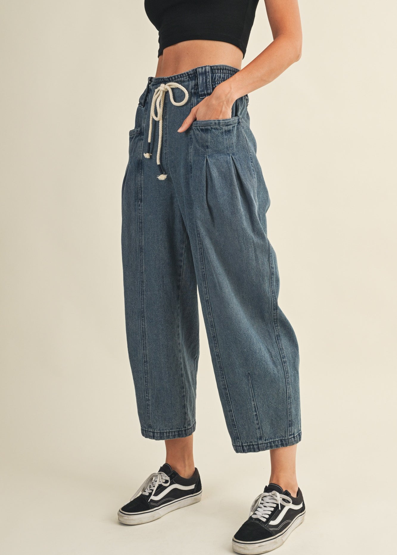 Side view of Margo pleated pull-on denim pants showing relaxed fit