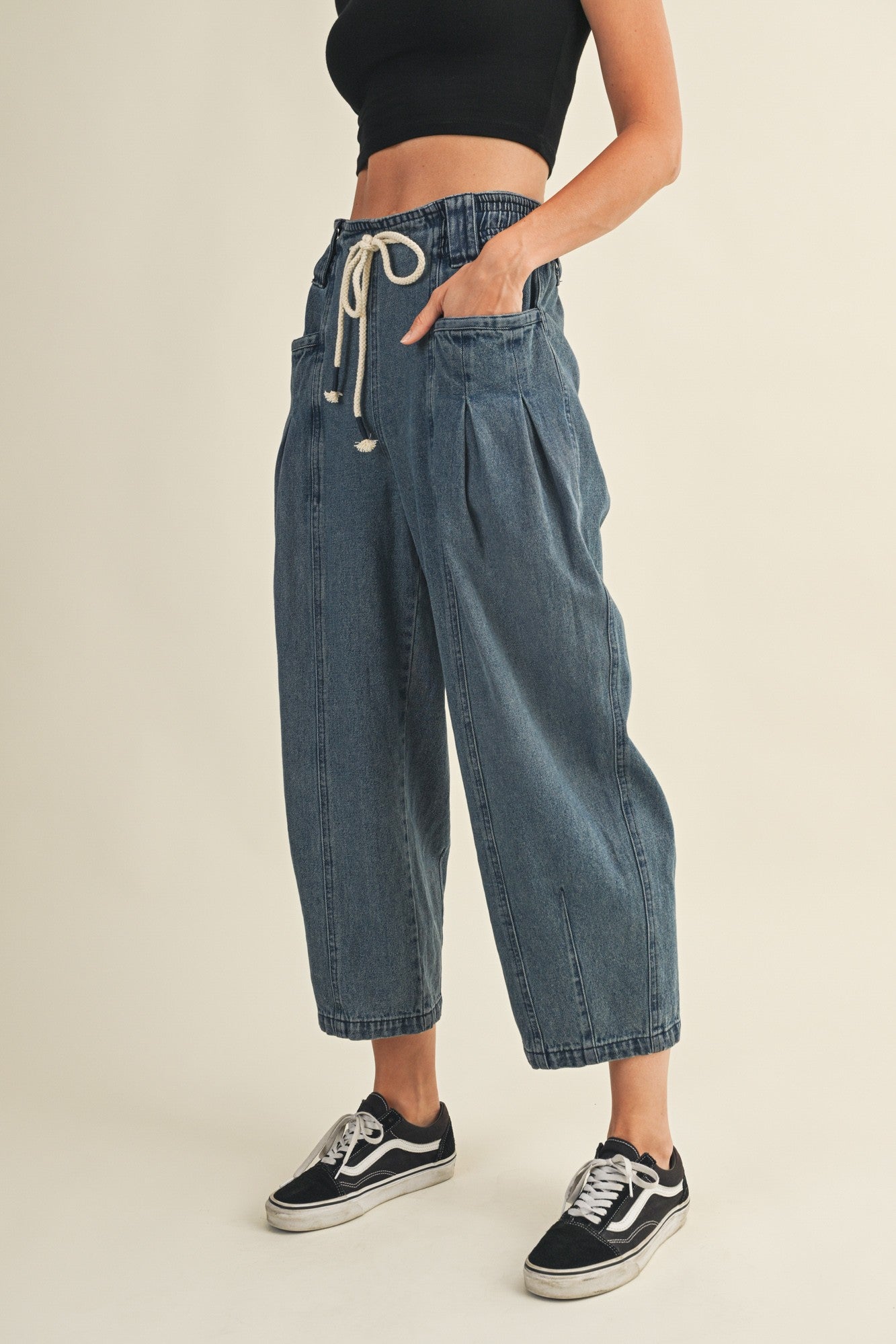 Side view of Margo pleated pull-on denim pants showing relaxed fit