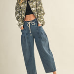 model s wearing margo pleated pull-on denim pants styled with jacket and sneakers