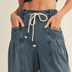 Drawstring waistband detail on Margo pleated pull-on denim pants