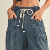 Drawstring waistband detail on Margo pleated pull-on denim pants