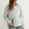 Person wearing a Marina relaxed fit shirt and wide-leg jeans against a plain background