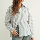 Person wearing a Marina relaxed fit shirt and wide-leg jeans against a plain background