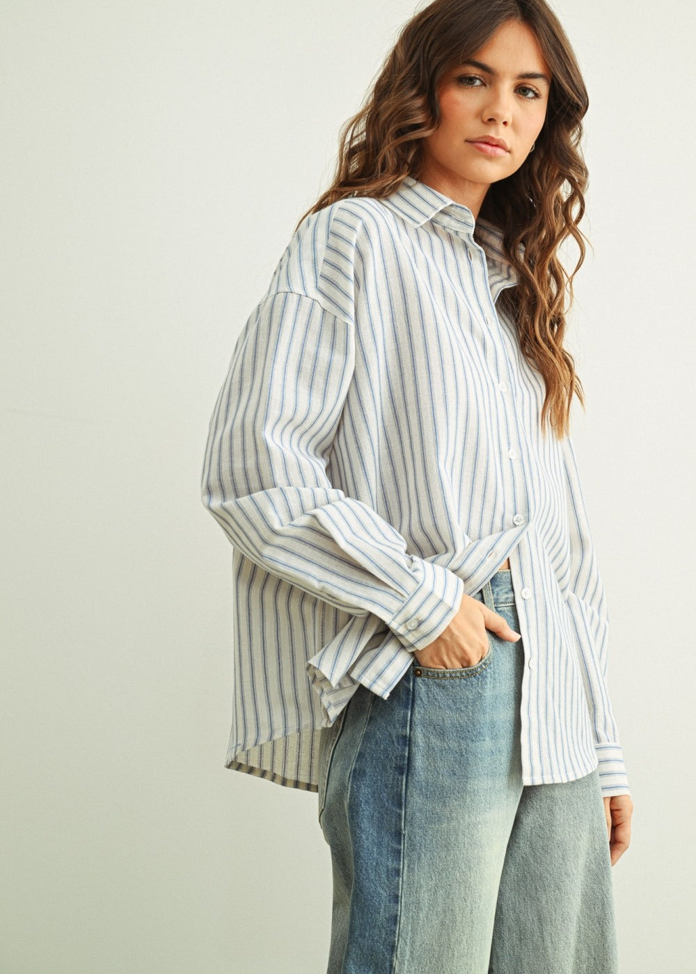 Marina blue striped button-down shirt with relaxed fit and dropped shoulders