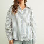 Marina blue striped button-down shirt with relaxed fit and dropped shoulders front