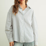 Marina blue striped button-down shirt with relaxed fit and dropped shoulders front