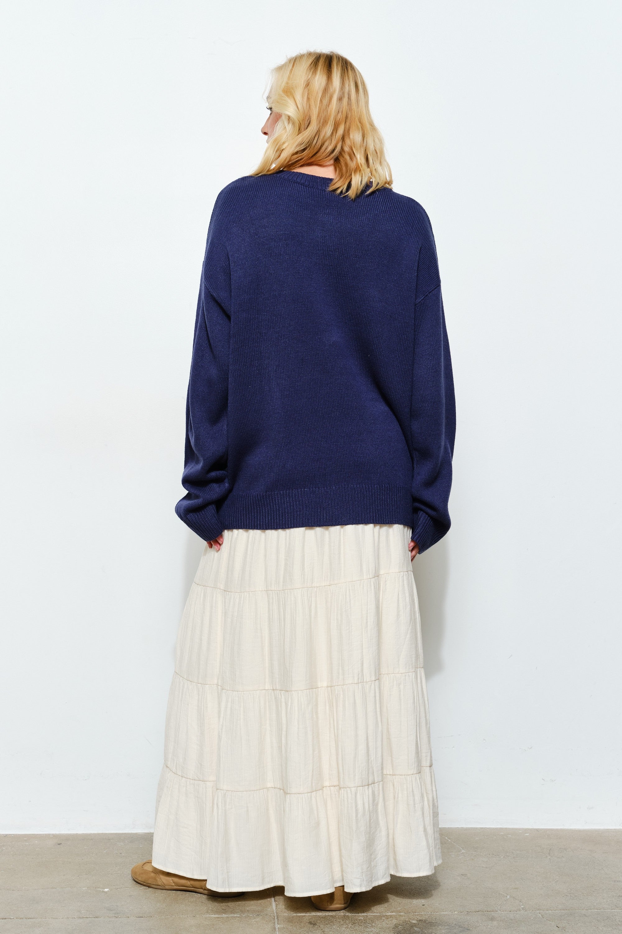Back of Marina Fish Knit Sweater in navy — relaxed chunky knit design with ribbed cuffs and hem.