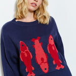 Side view of the Marina Fish Knit Sweater in navy — cozy oversized fit with soft textured knit fabric- sardine print