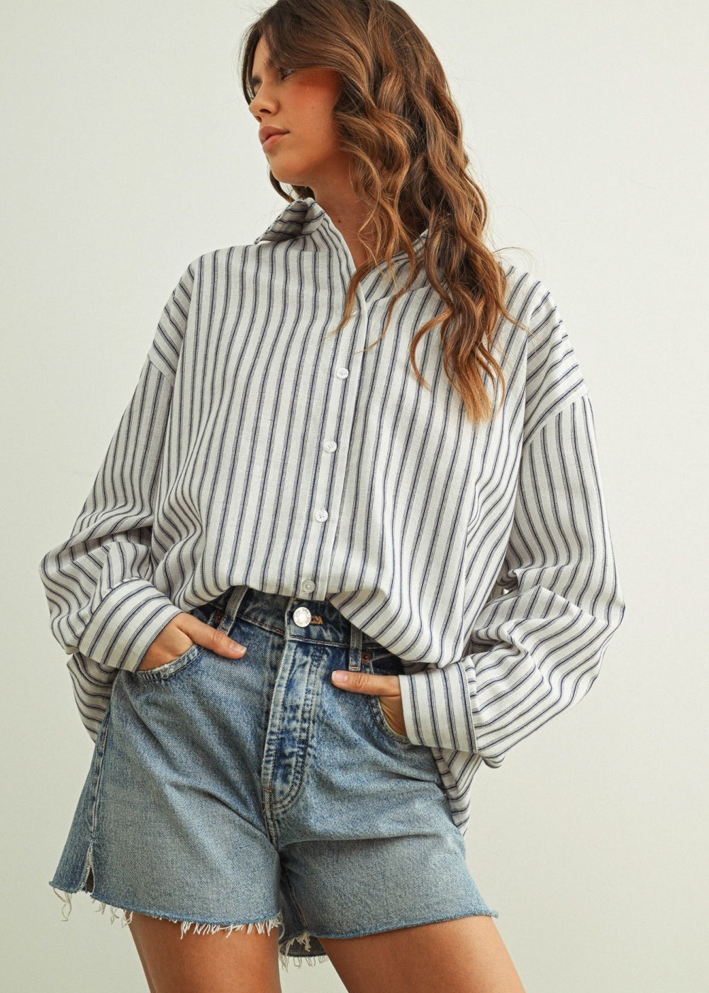 Marina navy striped button-down shirt with a relaxed fit and dropped shoulders