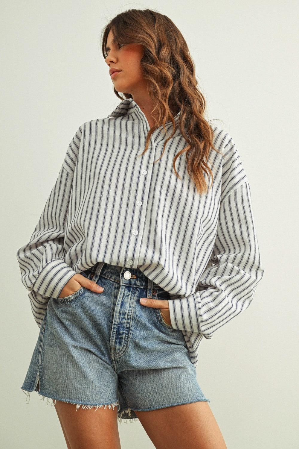 Marina navy striped button-down shirt with a relaxed fit and dropped shoulders