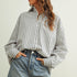 Marina navy striped button-down shirt with a relaxed fit and dropped shoulders