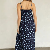 Back view of Marty Relaxed Maxi Dress in Midnight Polka Dot with stretchy smocked bodice