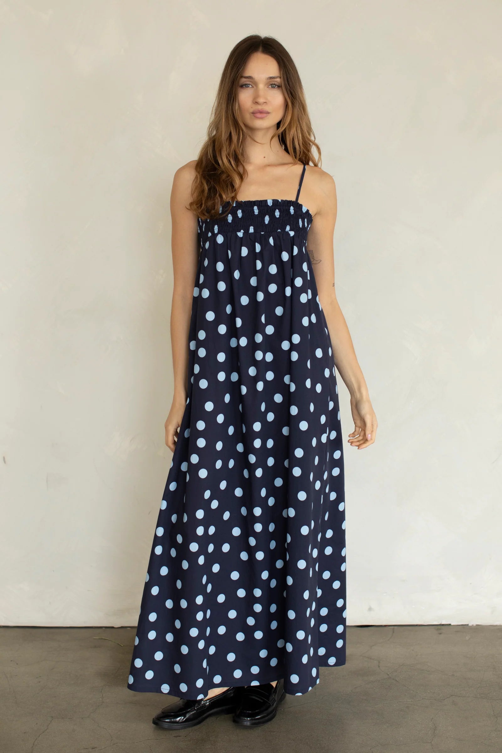 Marty Relaxed Maxi Dress in Midnight Polka Dot front view with smocked bodice and adjustable straps