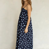 Side view of Marty Relaxed Maxi Dress in Midnight Polka Dot with relaxed flowy maxi silhouette