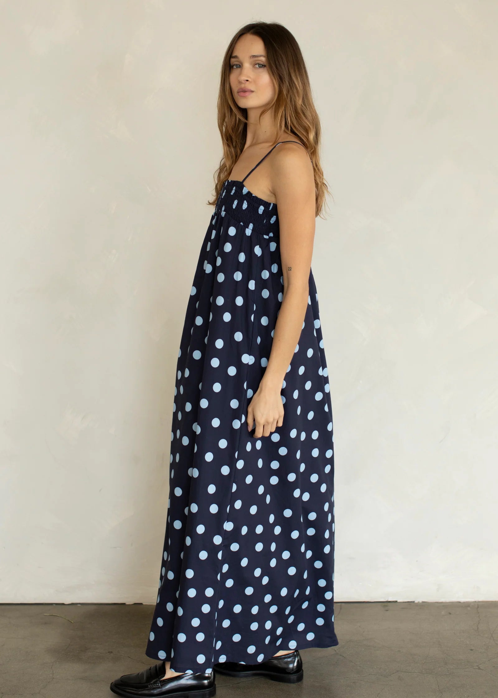 Side view of Marty Relaxed Maxi Dress in Midnight Polka Dot with relaxed flowy maxi silhouette