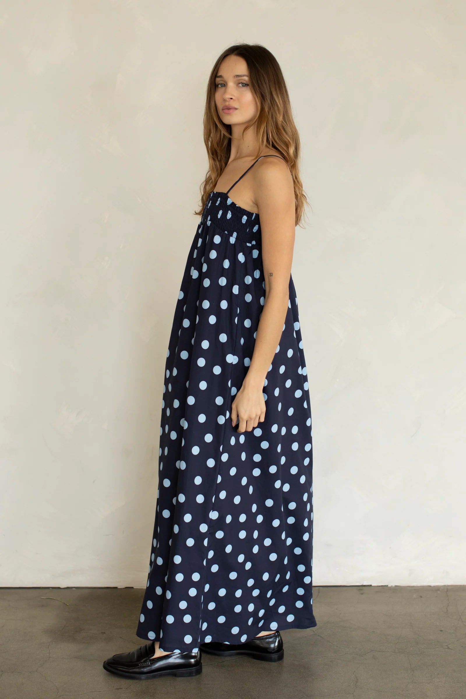 Side view of Marty Relaxed Maxi Dress in Midnight Polka Dot with relaxed flowy maxi silhouette