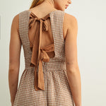 Back detail of Mila Gingham Bow Back Wide Leg Jumpsuit in Brown showing bow ties
